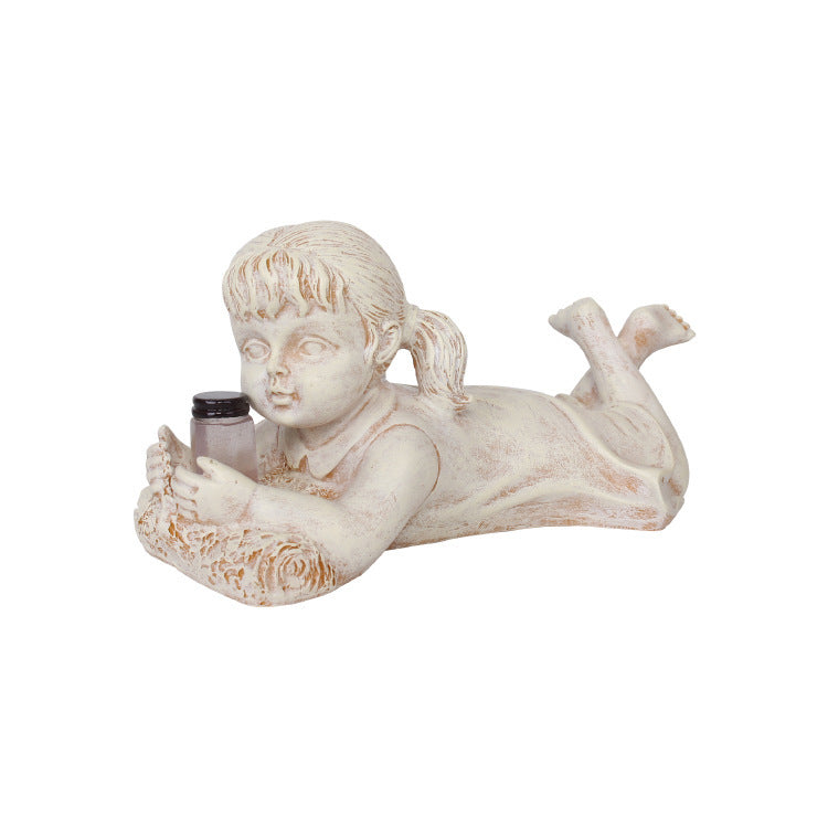 A charming garden statue crafted from resin, depicting a boy and girl with a firefly jar, adding whimsy and delight to your outdoor space.