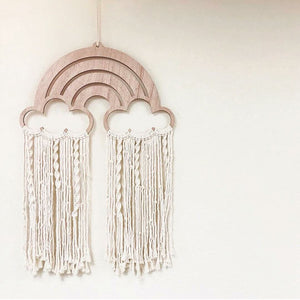 A colorful macrame wall hanging dream catcher featuring a rainbow design, adding a whimsical and bohemian touch to your space while warding off bad dreams.
