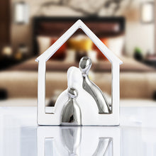 Adorable ceramic figurines portraying a loving couple, perfect for adding a sweet and sentimental touch to any space.