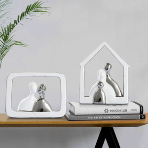 Adorable ceramic figurines portraying a loving couple, perfect for adding a sweet and sentimental touch to any space.