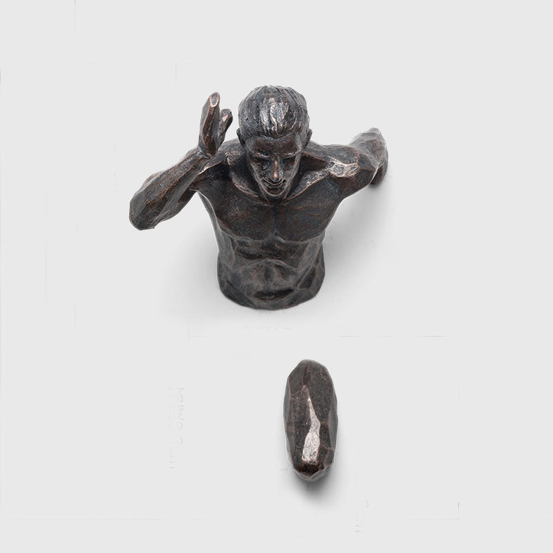 Running Character Wall Hanging Figurine: A dynamic wall hanging figurine depicting a running character in motion, adding energy and personality to your decor.