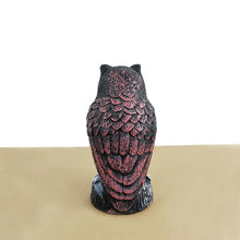 A delightful small owl figurine designed for garden decoration, adding whimsy and charm to outdoor spaces.