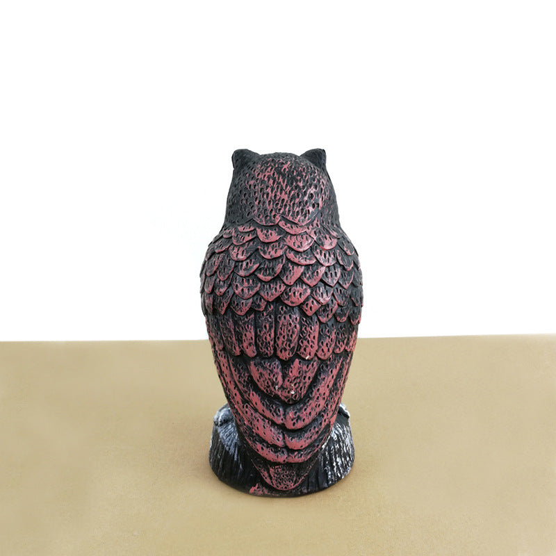 A delightful small owl figurine designed for garden decoration, adding whimsy and charm to outdoor spaces.