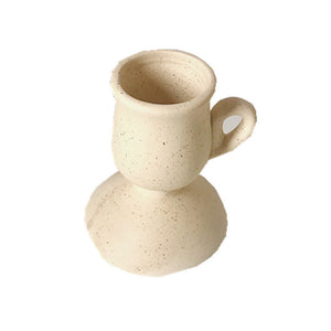 Ceramic Hand-held Candle Holder Decoration: A beautifully crafted ceramic candle holder designed to be held by hand, adding a touch of warmth and style to any space.