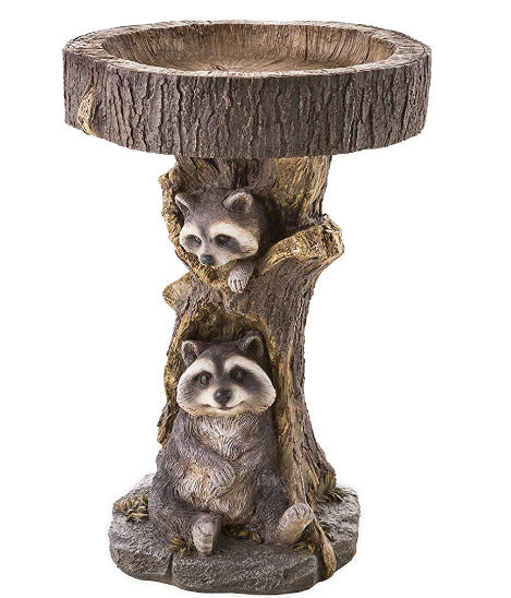 A delightful garden ornament featuring a small raccoon by a bird bath, crafted from resin to add a charming touch to your outdoor decor.