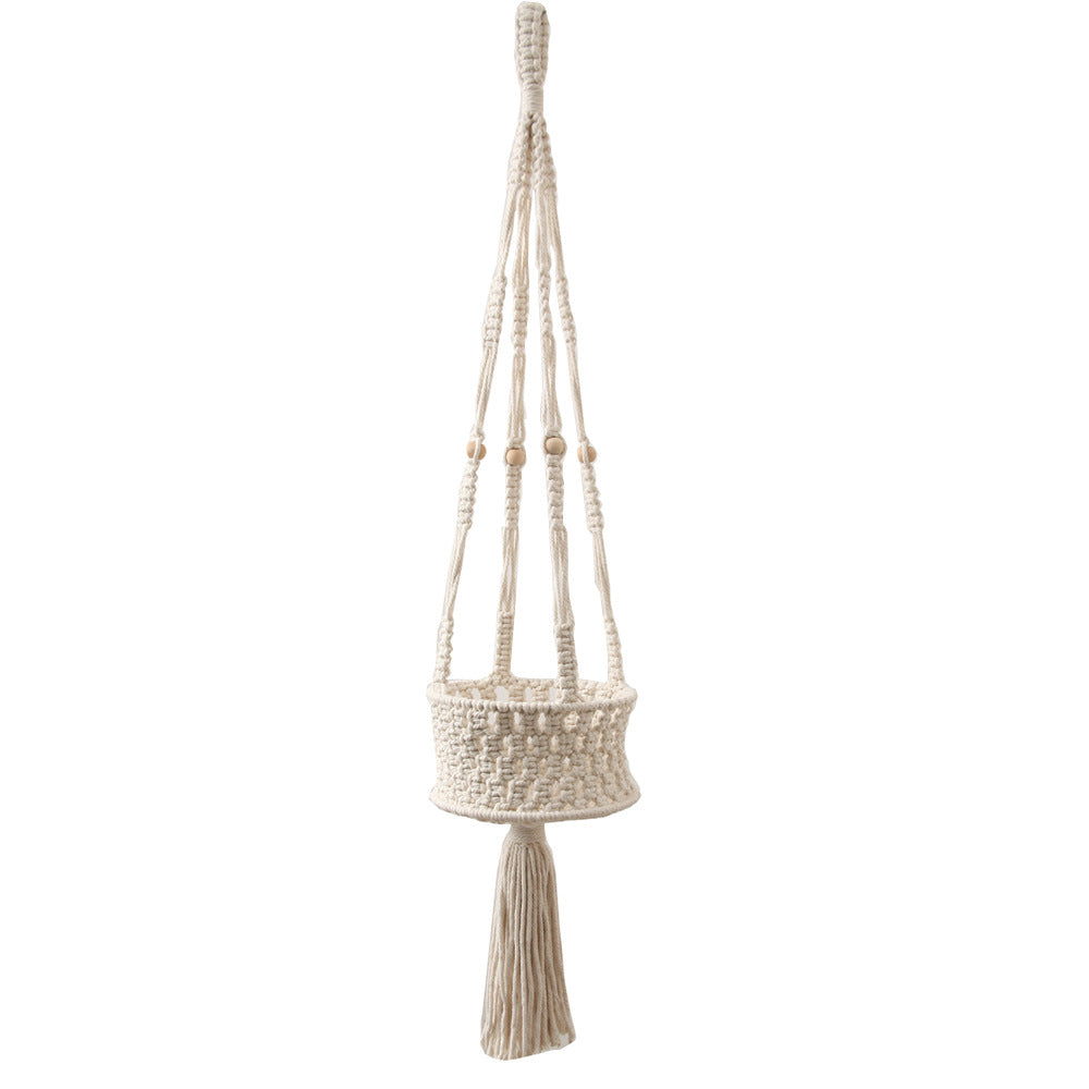 A stylish macrame plant hanger designed to hold flower pots, serving as both a functional planter and decorative wall accent.
