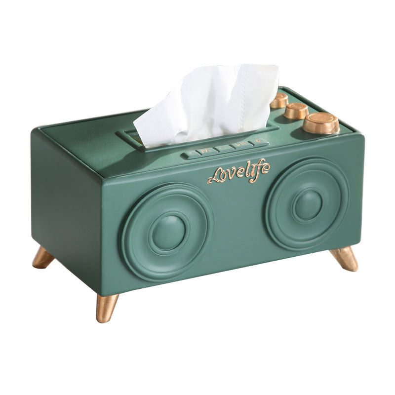 A unique tissue holder inspired by retro speakers, serving as a quirky and nostalgic coffee table decoration