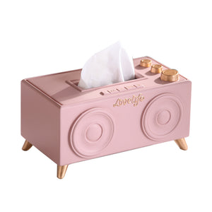 A unique tissue holder inspired by retro speakers, serving as a quirky and nostalgic coffee table decoration