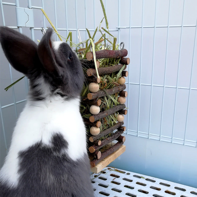  A practical feeder designed for rabbits to easily access and enjoy fresh grass, promoting their health and well-being in a convenient and efficient manner.