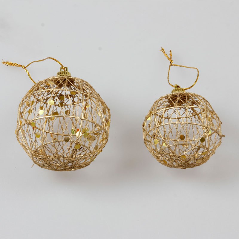 A festive Christmas ball ornament with a scaly texture and golden dusting, adding a touch of glamour and sparkle to holiday decorations.