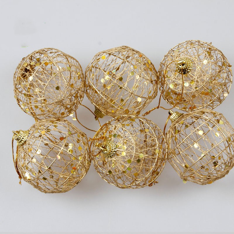 A festive Christmas ball ornament with a scaly texture and golden dusting, adding a touch of glamour and sparkle to holiday decorations.