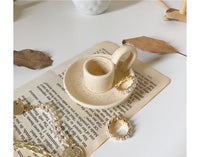 Ceramic Hand-held Candle Holder Decoration: A beautifully crafted ceramic candle holder designed to be held by hand, adding a touch of warmth and style to any space.