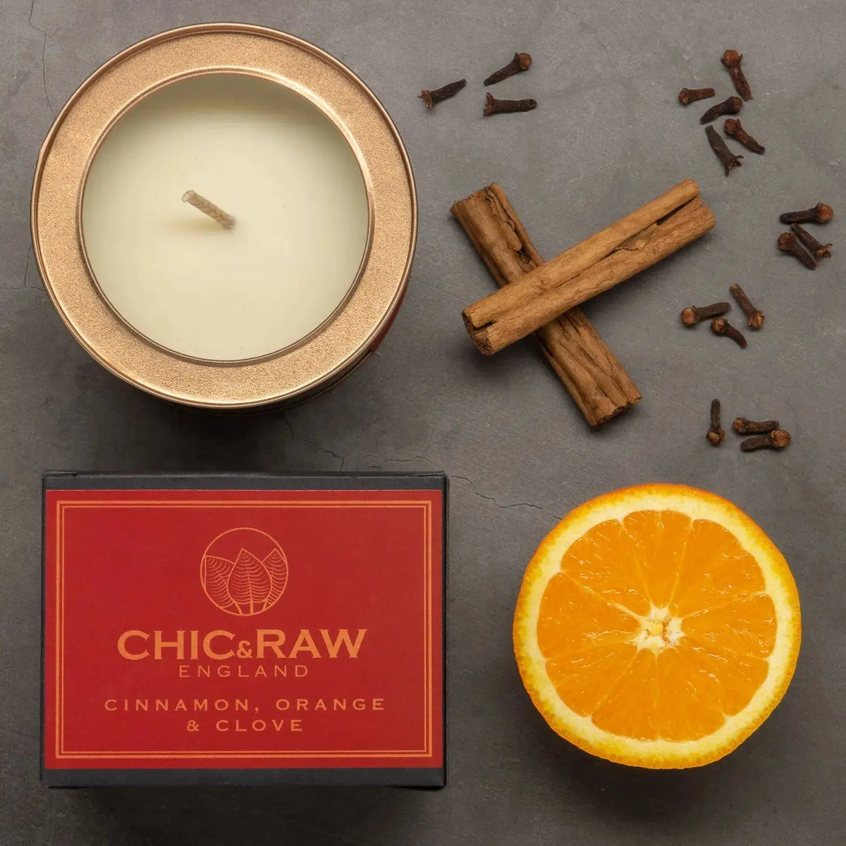 Candle in a tin with cinnamon, orange, and clove scent, eco-friendly