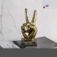 A stylish resin figurine featuring a hand gesture design, adding a modern and artistic flair to your home decor.