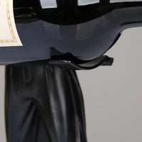 A whimsical wine holder featuring a magician figurine, adding a touch of enchantment and charm to your wine display.