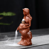 Creative Conch Mermaid Incense Burner: An imaginative incense burner shaped like a conch shell with a mermaid design, adding a whimsical touch to your space while infusing it with delightful fragrances.