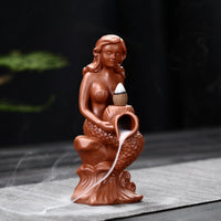 Creative Conch Mermaid Incense Burner: An imaginative incense burner shaped like a conch shell with a mermaid design, adding a whimsical touch to your space while infusing it with delightful fragrances.