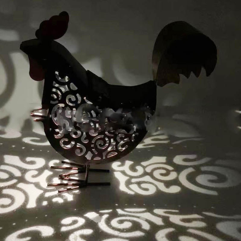 A decorative garden lamp featuring a rustic rooster design, powered by solar energy for eco-friendly illumination in outdoor spaces.