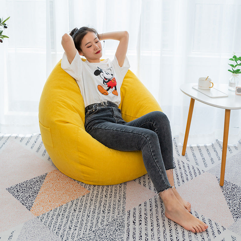 A comfortable and versatile bean bag cover for a lazy sofa, providing a cozy seating option with a relaxed and casual vibe.