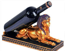 A regal wine bottle holder in the shape of an Egyptian Pharaoh Sphinx, adding an exotic and majestic touch to your home decor.