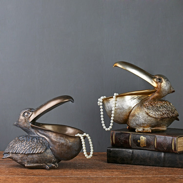 A decorative toucan statue designed as a jewelry and key organizer, adding a tropical and functional touch to your home decor.