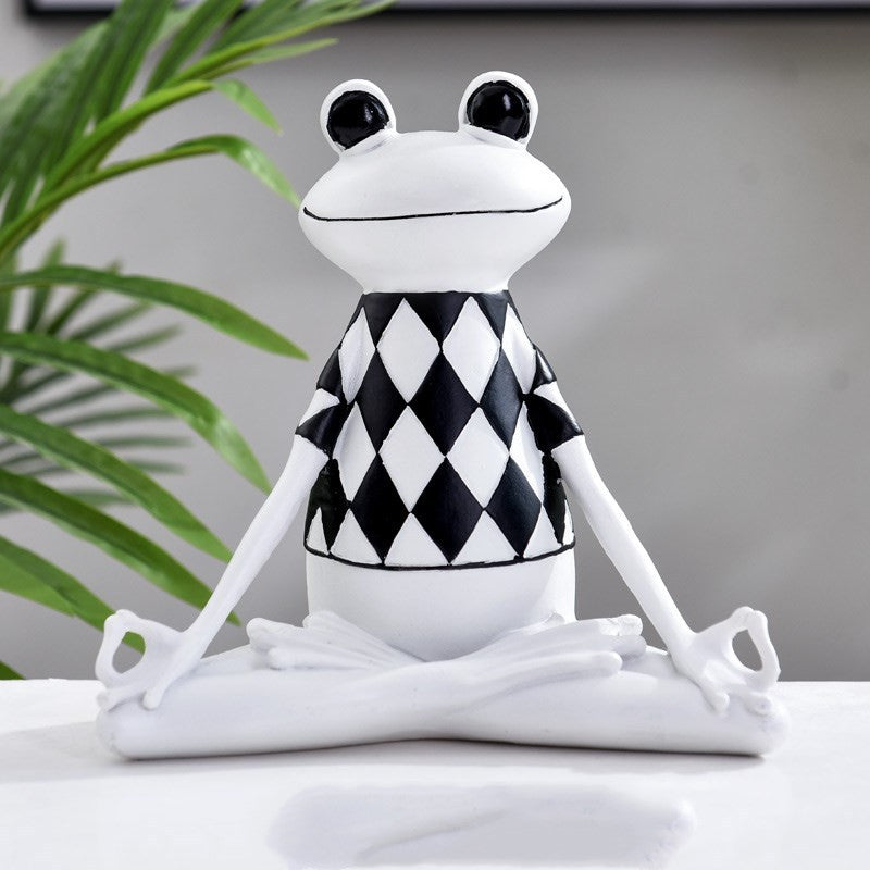 Charming figurines depicting frogs in various yoga poses, adding a whimsical and zen-inspired touch to your home decor.