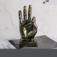 A stylish resin figurine featuring a hand gesture design, adding a modern and artistic flair to your home decor.