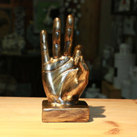 A stylish resin figurine featuring a hand gesture design, adding a modern and artistic flair to your home decor.