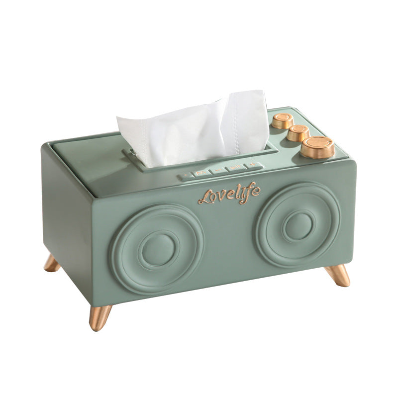 A unique tissue holder inspired by retro speakers, serving as a quirky and nostalgic coffee table decoration