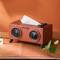 A unique tissue holder inspired by retro speakers, serving as a quirky and nostalgic coffee table decoration