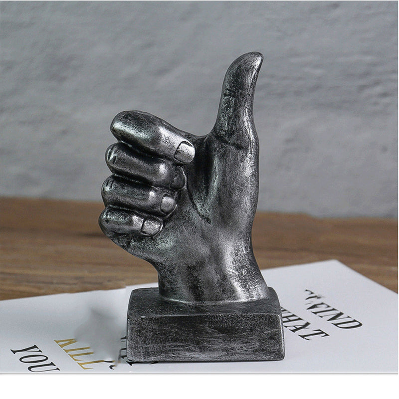 A stylish resin figurine featuring a hand gesture design, adding a modern and artistic flair to your home decor.