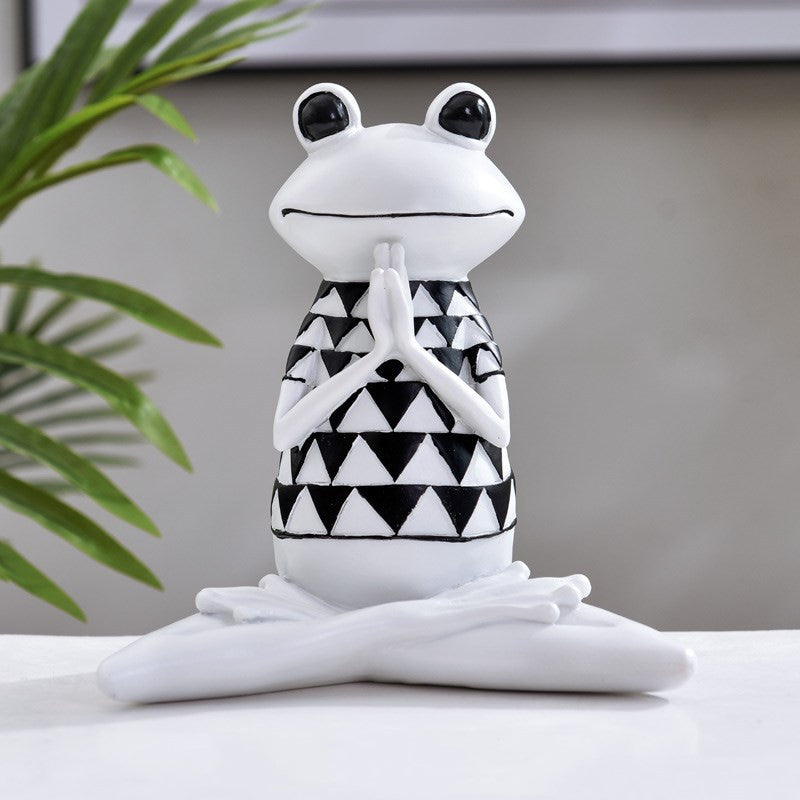 Charming figurines depicting frogs in various yoga poses, adding a whimsical and zen-inspired touch to your home decor.