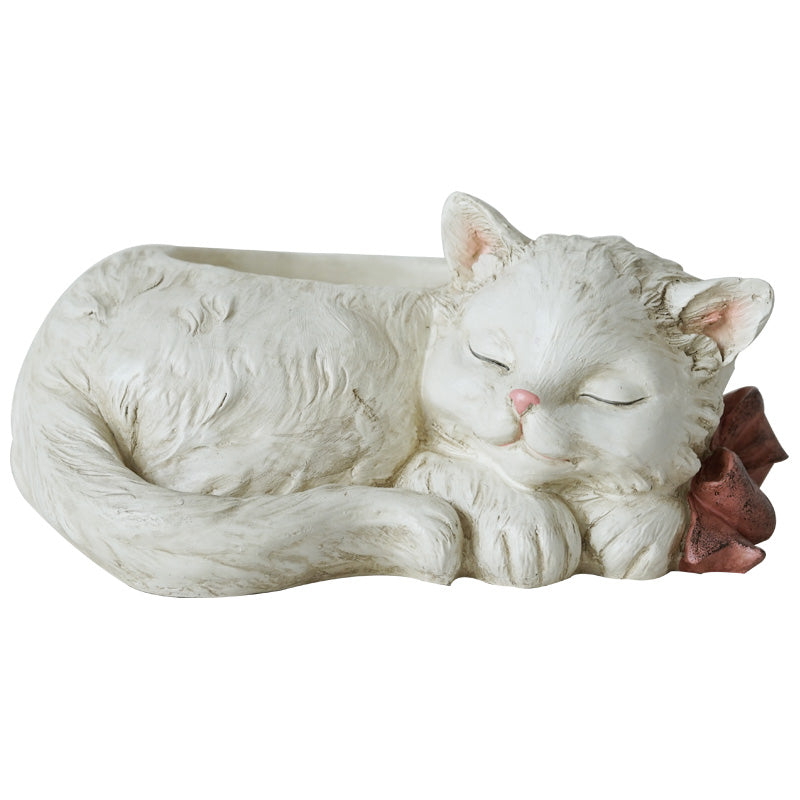 A charming resin planter creatively designed in the shape of a little white cat, adding a whimsical touch to your indoor or outdoor plant display.