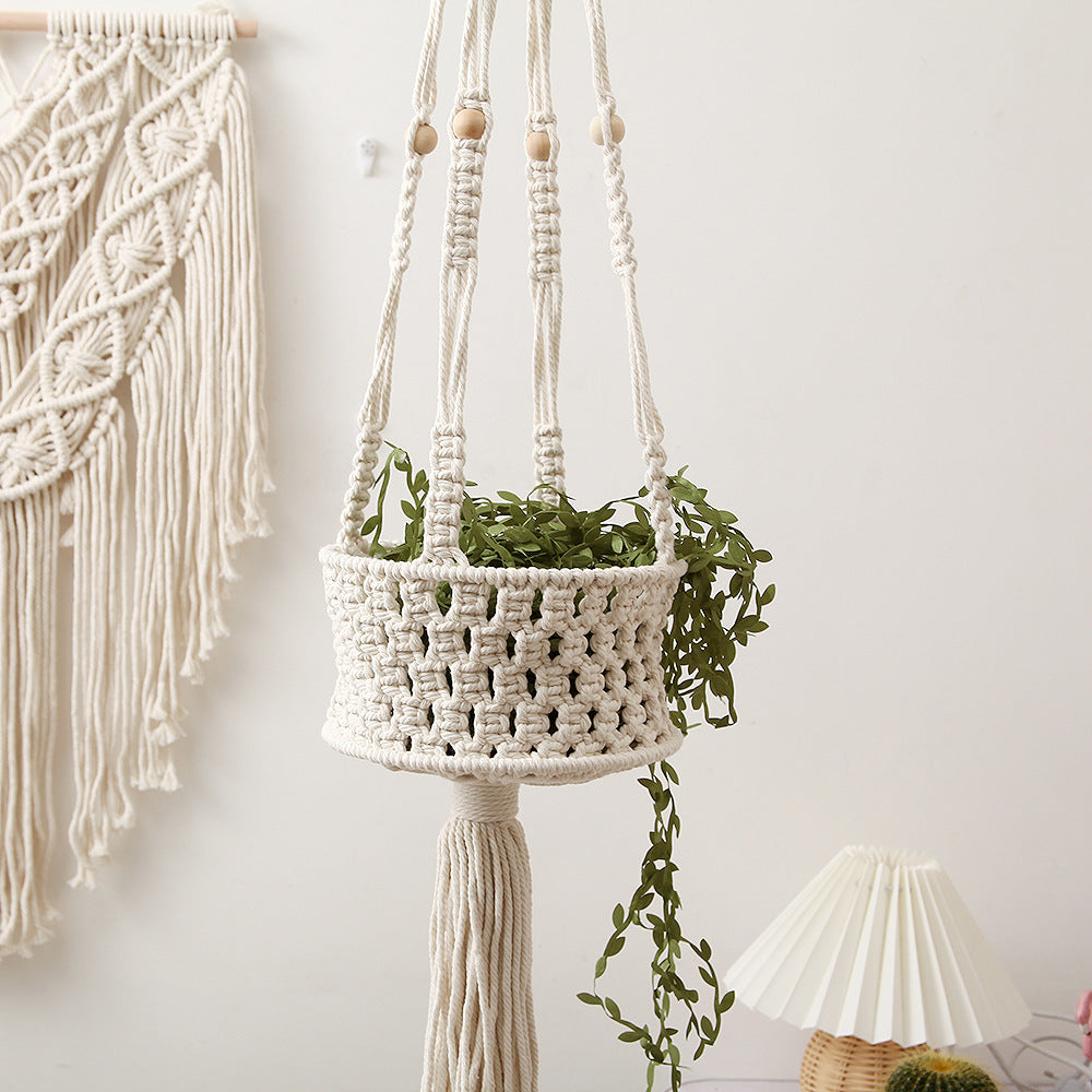 A stylish macrame plant hanger designed to hold flower pots, serving as both a functional planter and decorative wall accent.