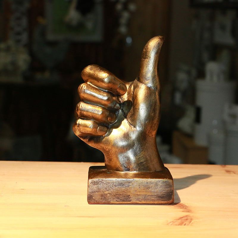 A stylish resin figurine featuring a hand gesture design, adding a modern and artistic flair to your home decor.