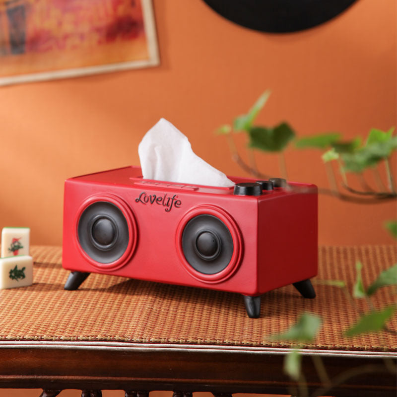 A unique tissue holder inspired by retro speakers, serving as a quirky and nostalgic coffee table decoration